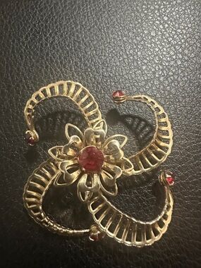 Gold Floral Swirl Brooch with Red Gem Accents